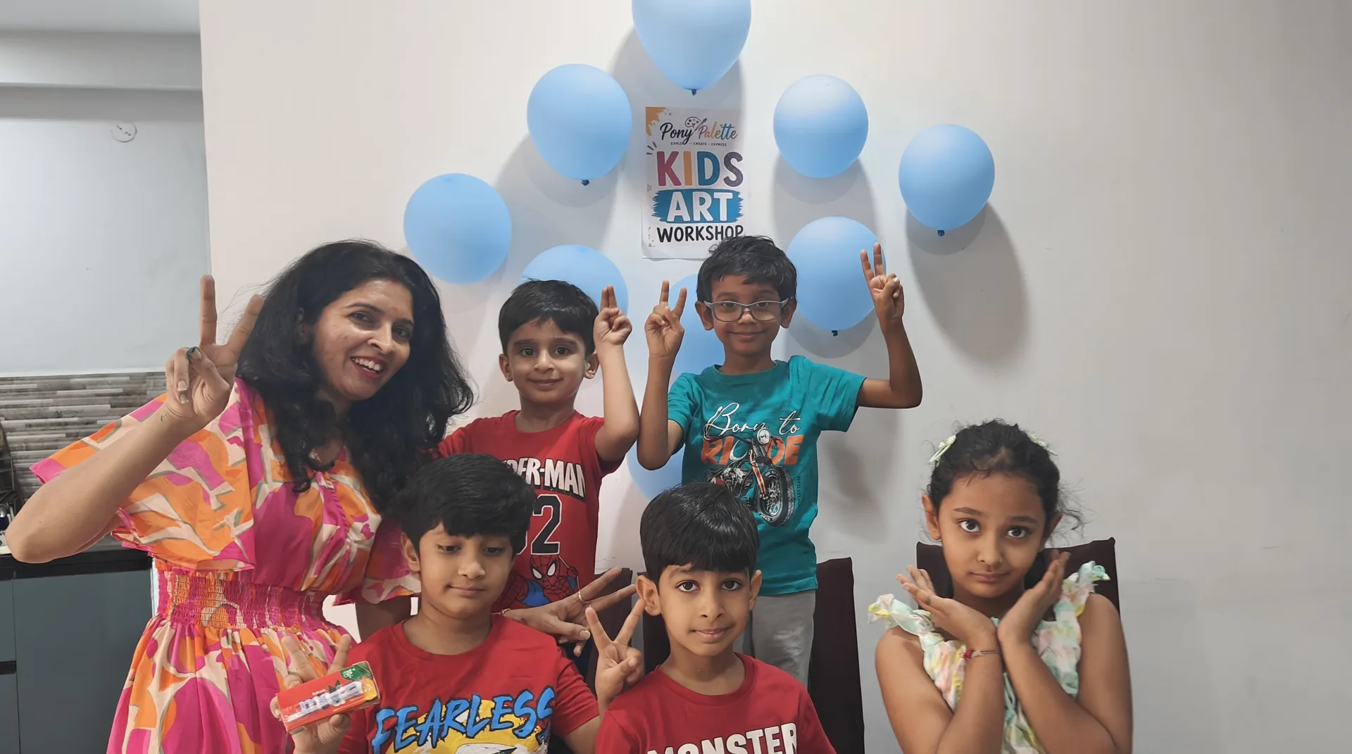 Children learning drawing and painting in a small-group art class in Hyderabad